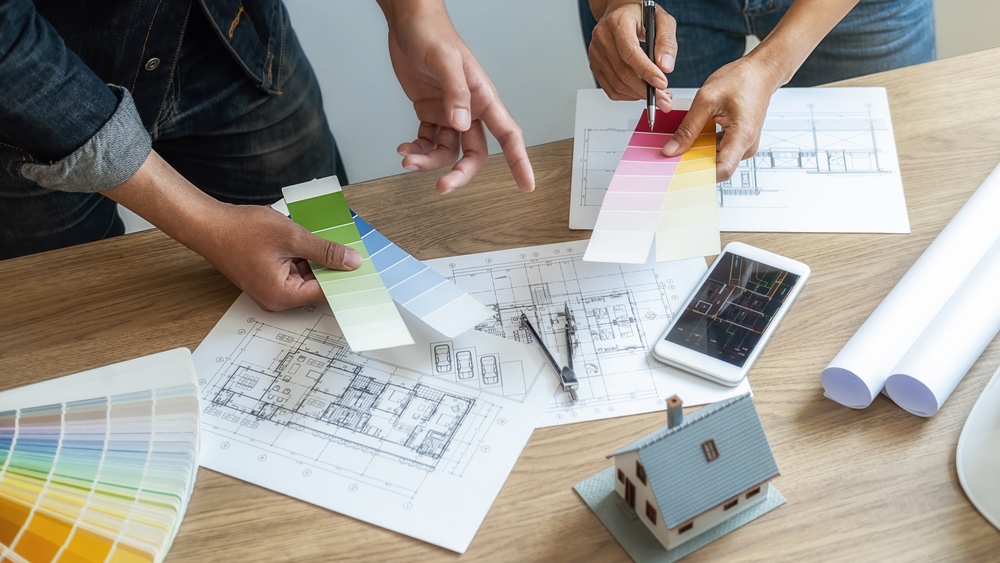 Couple picking out colours from sample cards